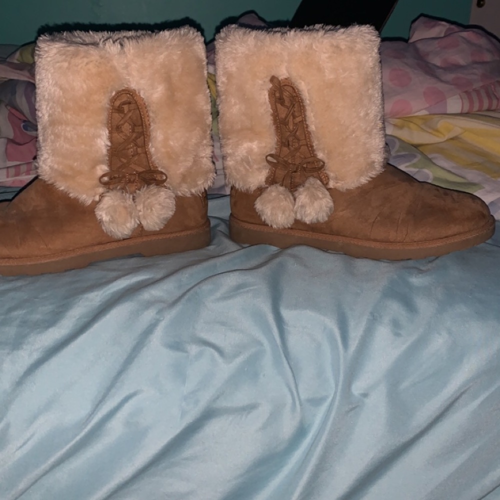 Fuzzy brown and cream boots.